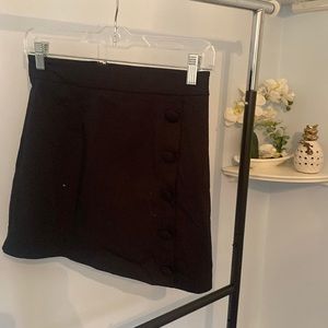 Black mini skirt with side button detail